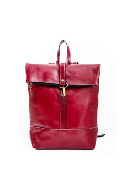 Handmade red leather rolltop backpack with buckle strap, crafted in Crete